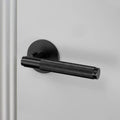 Buster and Punch Privacy Door Handle Set with Cross Knurl Pattern in Black Solid Metal