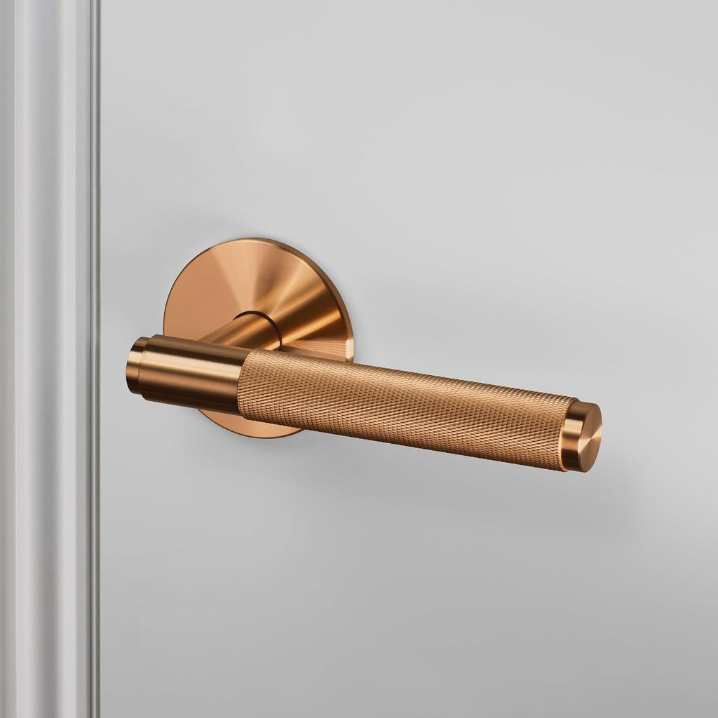 Buster and Punch Door Handle Set Passage Cross Knurl in Warm Sunset