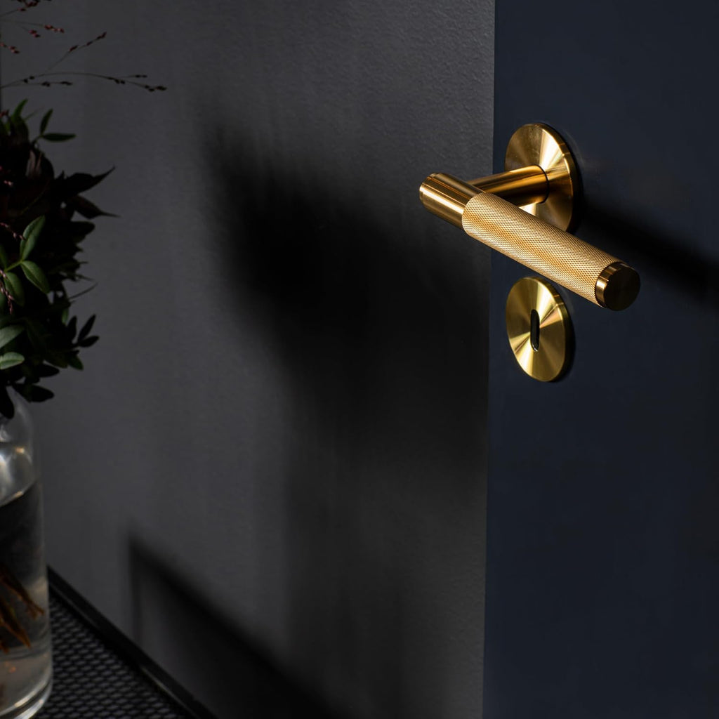 Buster and Punch Door Handle Set Passage Cross Knurl in Brass
