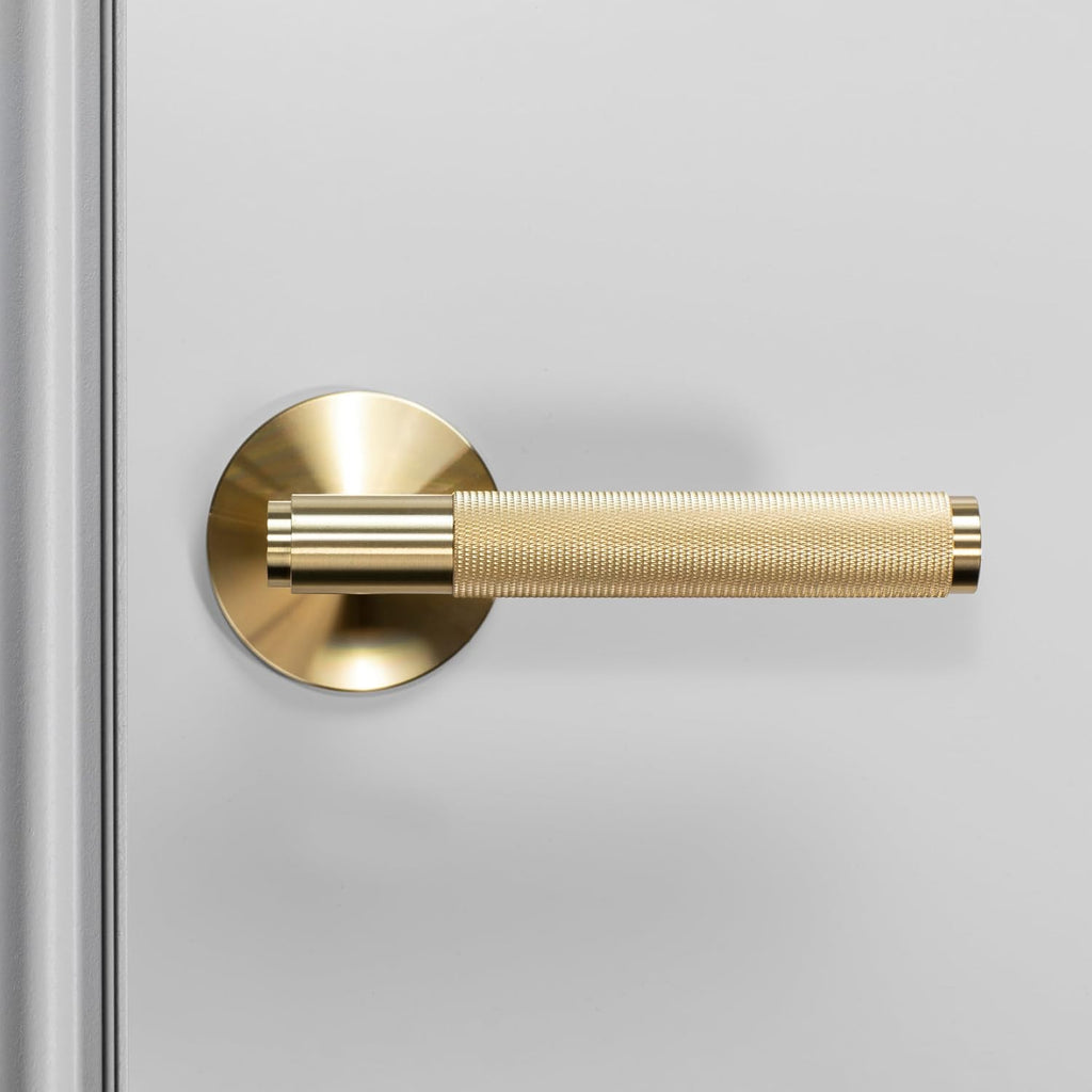 Buster and Punch Door Handle Set Passage Cross Knurl in Brass